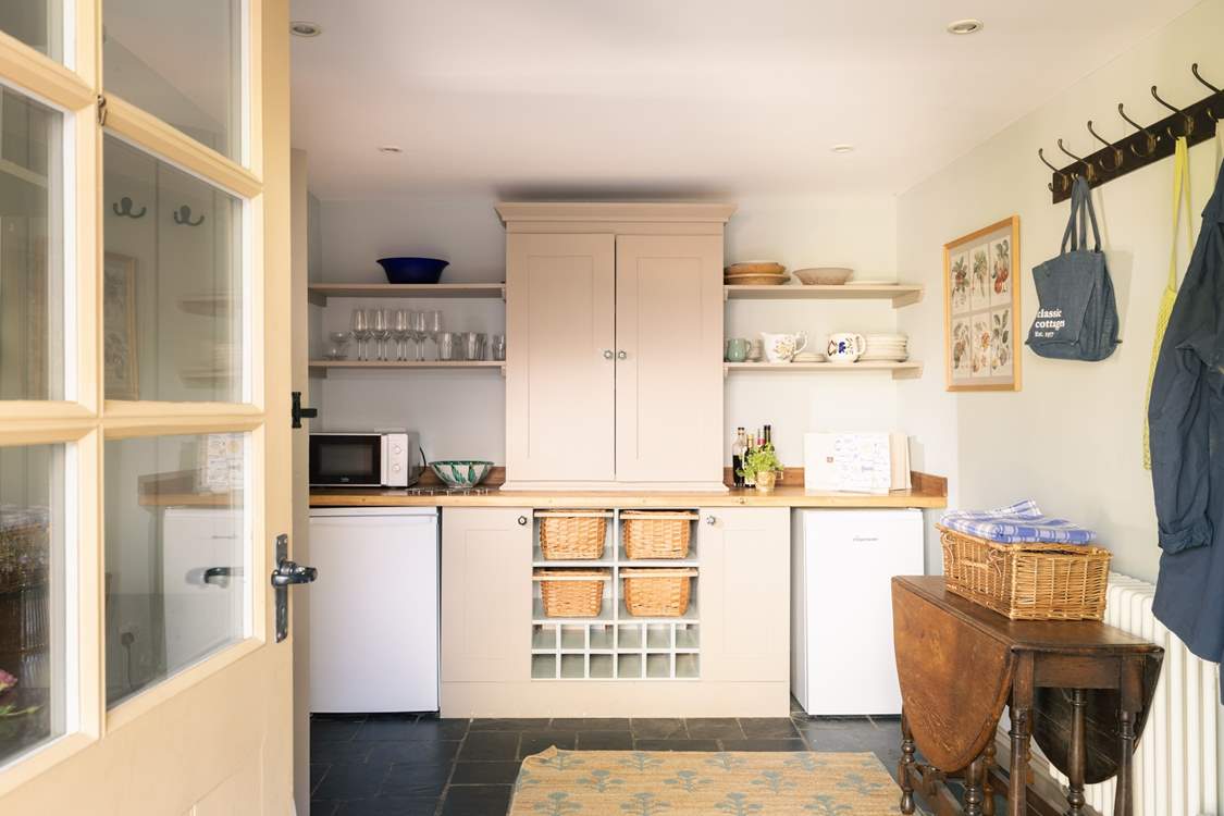 The large utility houses some kitchen equipment.