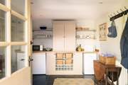 The large utility houses some kitchen equipment.