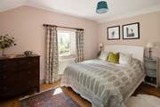 A calming bedroom with beautiful views.