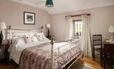 Sumptuous linens and soft furnishings grace the cottage.  - Thumbnail Image