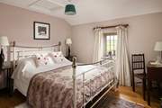 Sumptuous linens and soft furnishings grace the cottage.