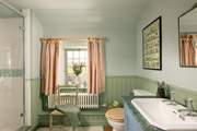 The bathroom has both a shower cubicle and a bath, take your pick.
