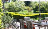 Sit amongst the beautiful borders and enjoy a relaxing meal and listen to the surrounding rustle of the trees.  - Thumbnail Image