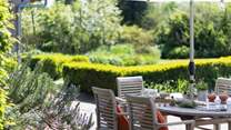 Sit amongst the beautiful borders and enjoy a relaxing meal and listen to the surrounding rustle of the trees. 