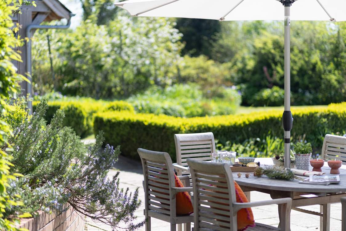 Sit amongst the beautiful borders and enjoy a relaxing meal and listen to the surrounding rustle of the trees.