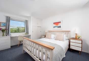 A huge king-size bedroom upstairs has outstanding views.