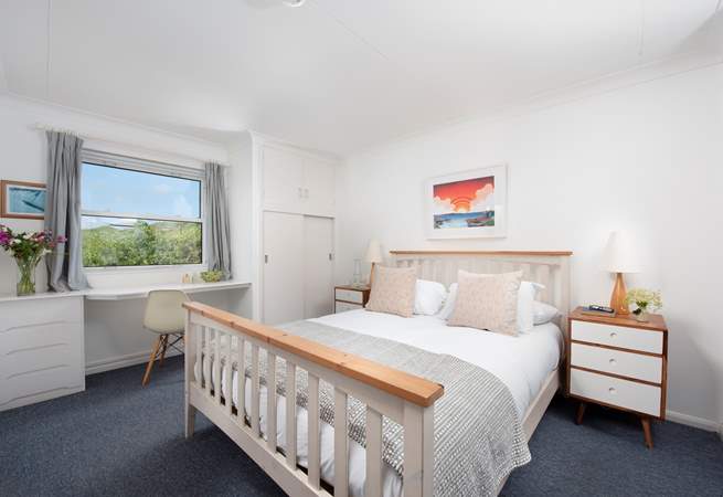 A huge king-size bedroom upstairs has outstanding views.