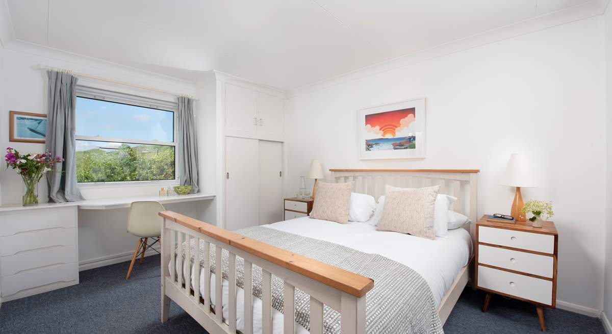 A huge king-size bedroom upstairs has outstanding views.