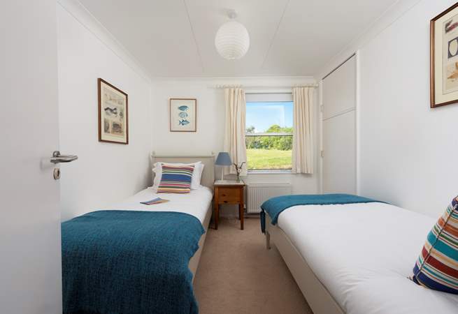 A sweet twin room on the ground floor with garden views.