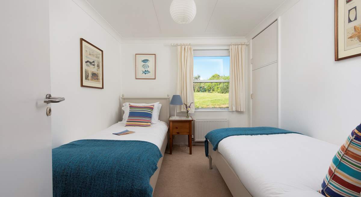A sweet twin room on the ground floor with garden views.