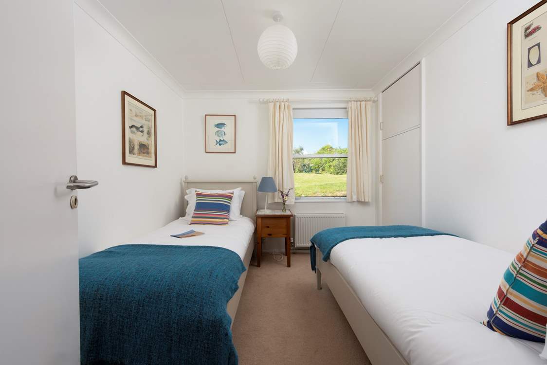 A sweet twin room on the ground floor with garden views.