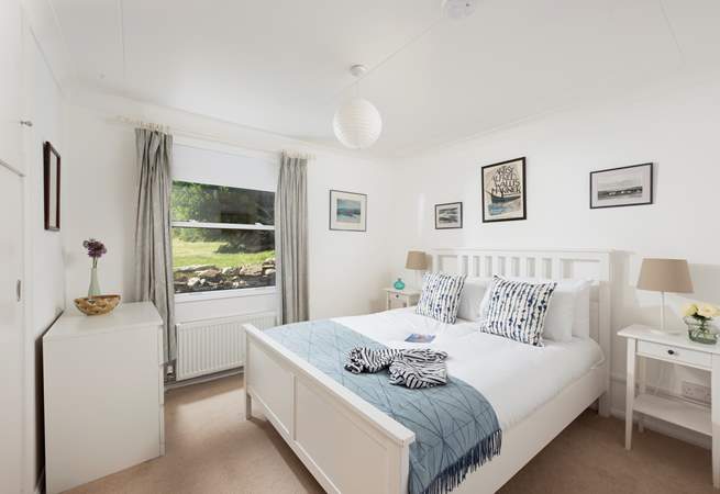 A king-size bedroom on the ground floor overlooking the gorgeous garden.