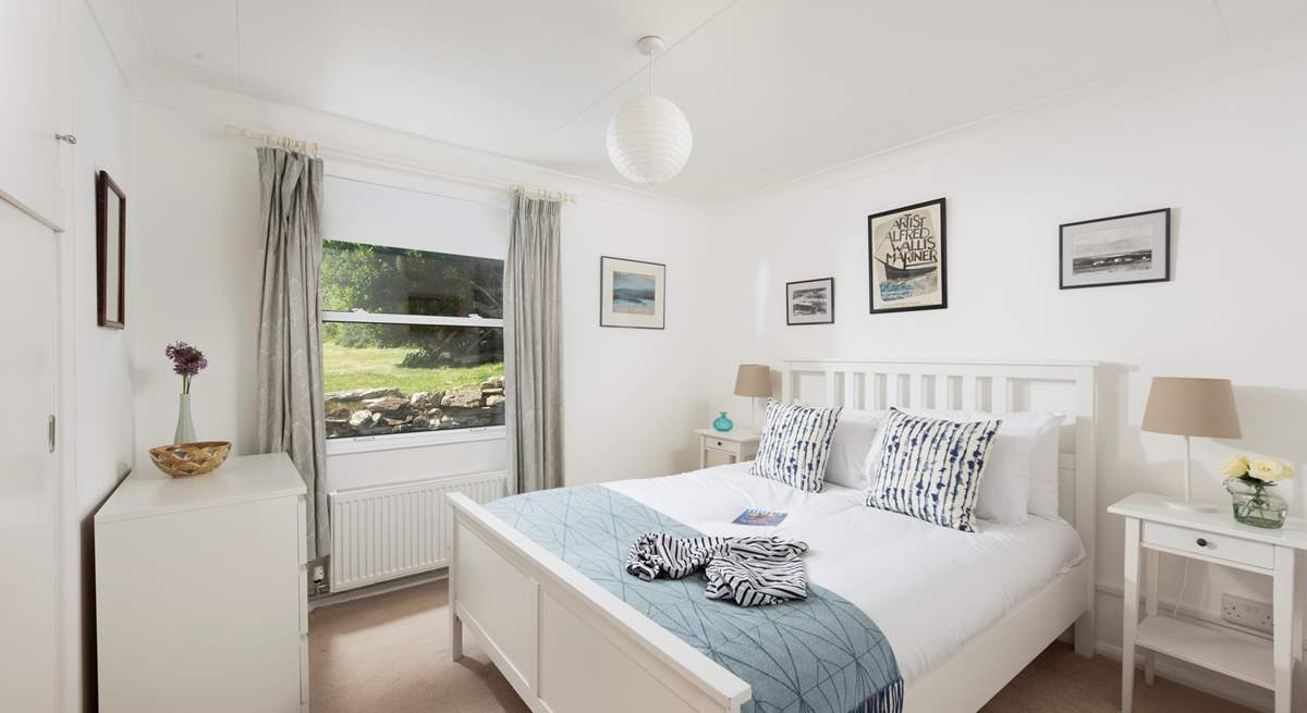A king-size bedroom on the ground floor overlooking the gorgeous garden.