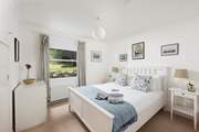 A king-size bedroom on the ground floor overlooking the gorgeous garden.