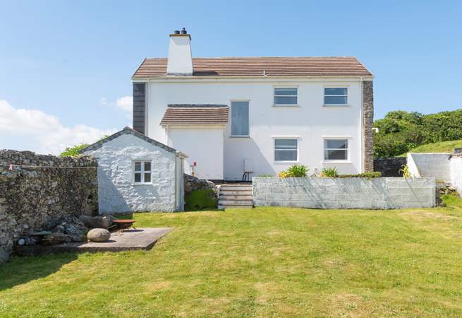 You can enjoy walled gardens, at the front and back of the home.