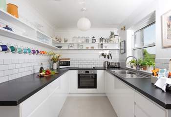 Spacious, light, and very well-equipped, the kitchen is a pleasure for any aspiring chef.