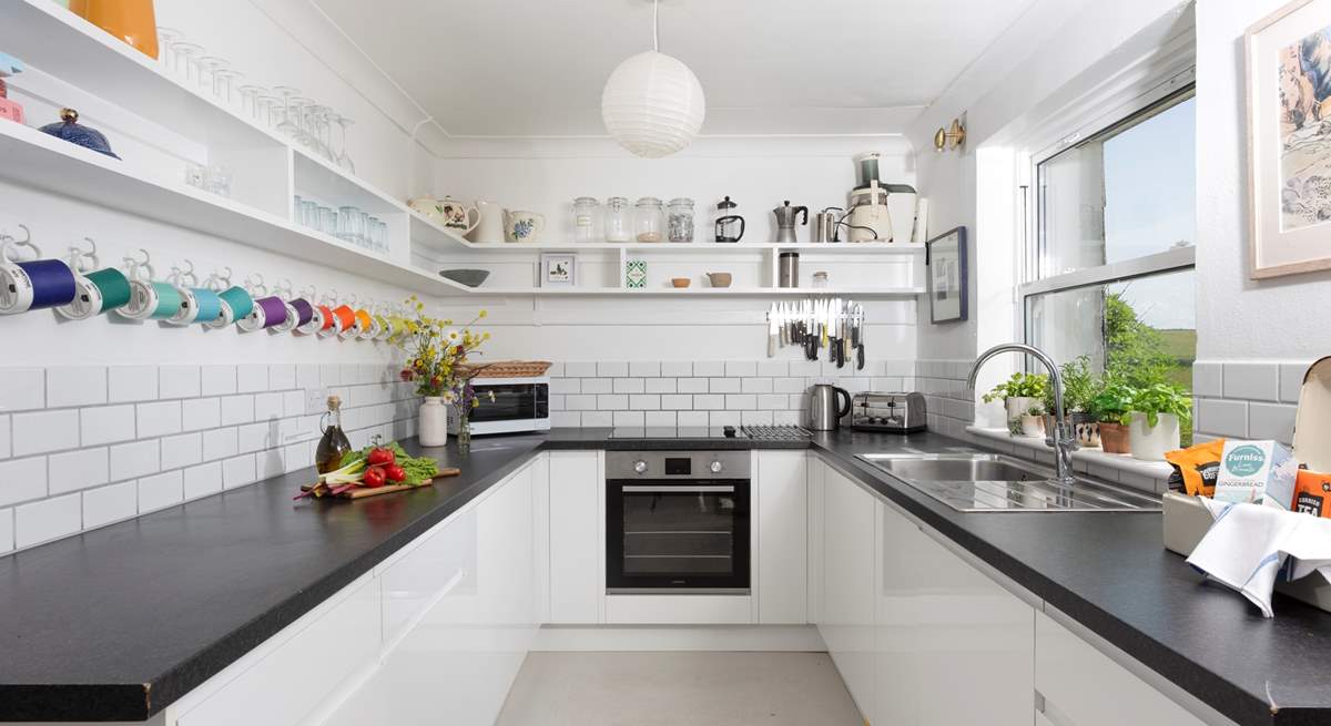 Spacious, light, and very well-equipped, the kitchen is a pleasure for any aspiring chef.