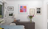 A mixture of eclectic art adorns the walls throughout the home. - Thumbnail Image