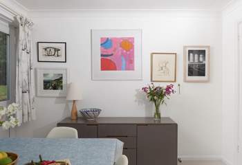 A mixture of eclectic art adorns the walls throughout the home.