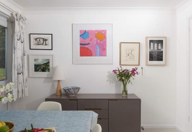 A mixture of eclectic art adorns the walls throughout the home.