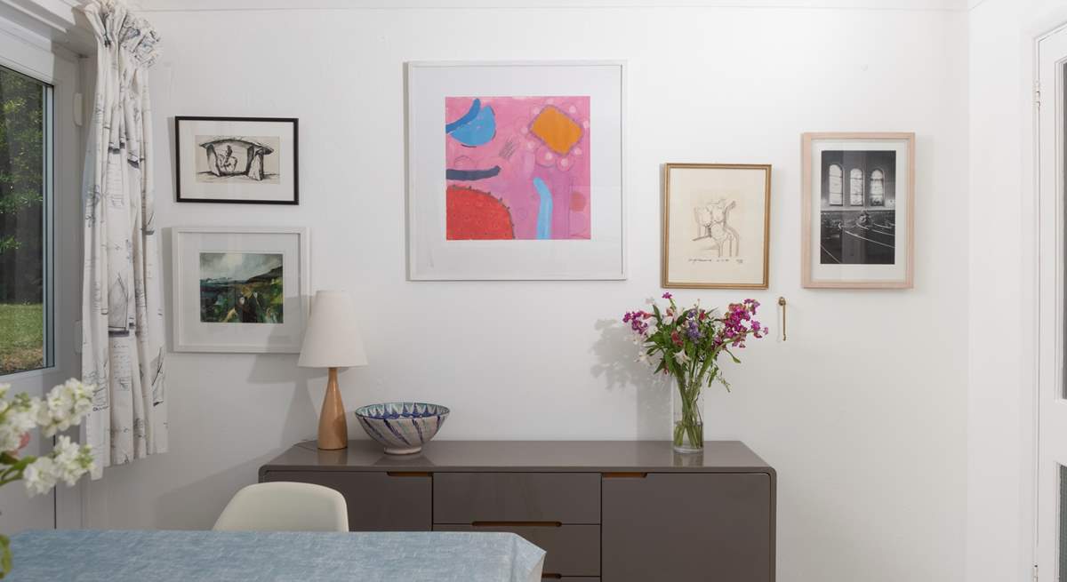 A mixture of eclectic art adorns the walls throughout the home.