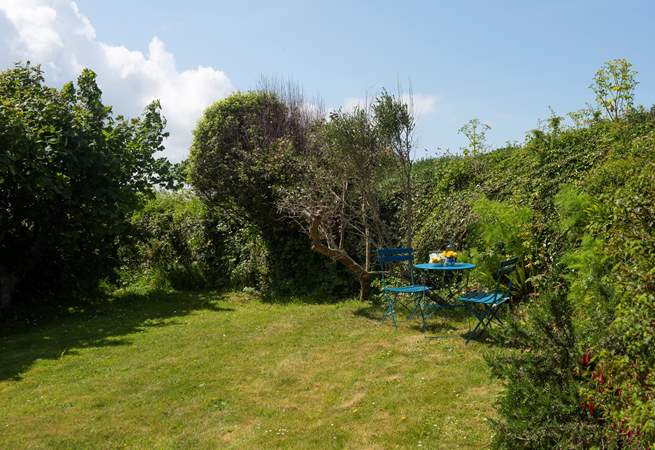 A charming back garden with plenty of places to sit back and relax.