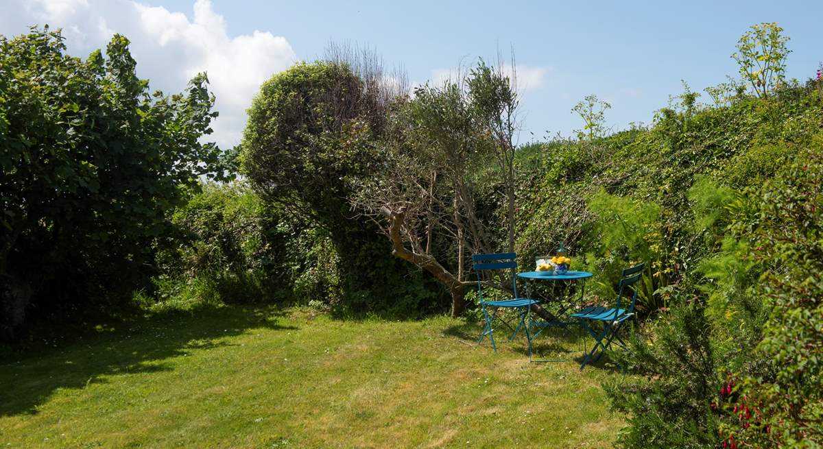 A charming back garden with plenty of places to sit back and relax.