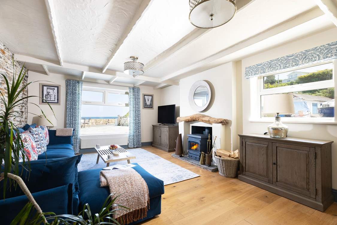 All you need throughout the seasons: a sea view, a warming wood-burner and a Smart TV.