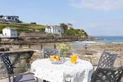 Beach House is a duplex apartment in a sublime location overlooking the beach at Portmellon.