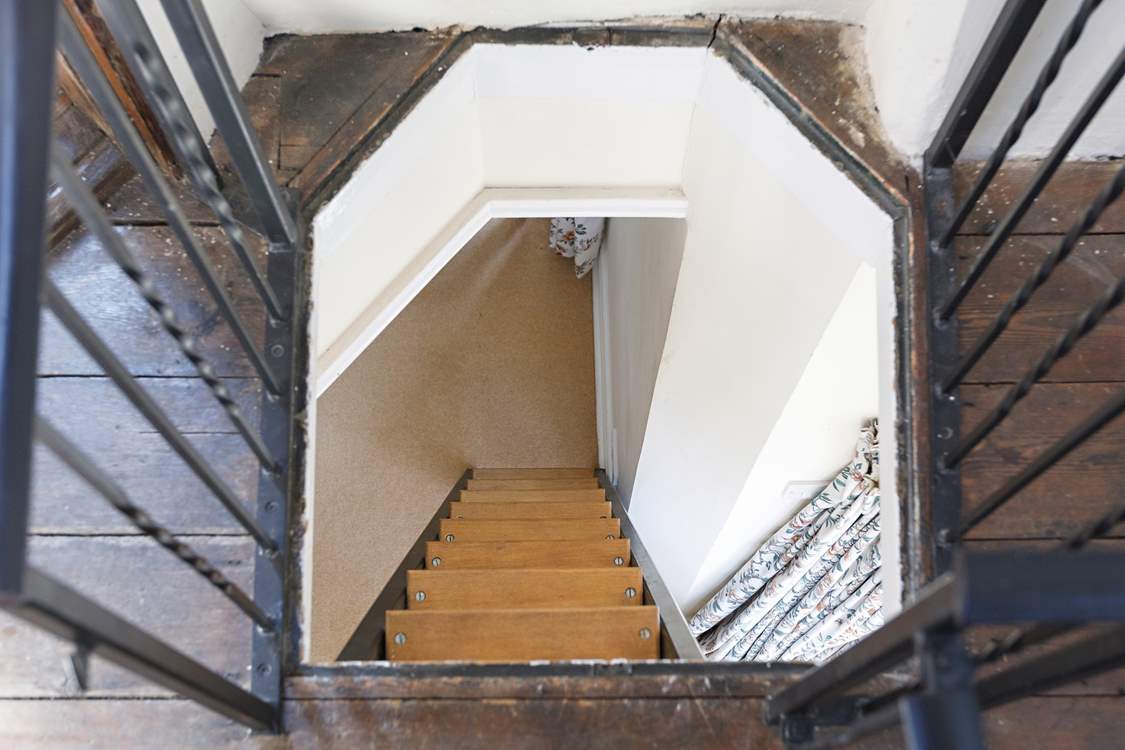 The stairs to the rooftop terrace, from above. Please take care when proceeding up and down the stair ladder to the balcony