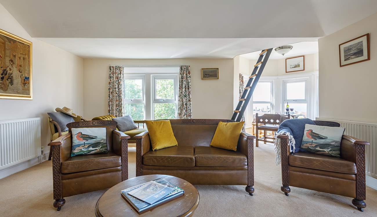 The spacious sitting-room where the sunshine floods in from the triple-aspect windows.