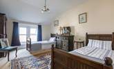 Full-size twin beds in the spacious second bedroom. - Thumbnail Image