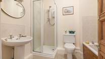 Enjoy a bath or shower at this unique apartment by the sea.