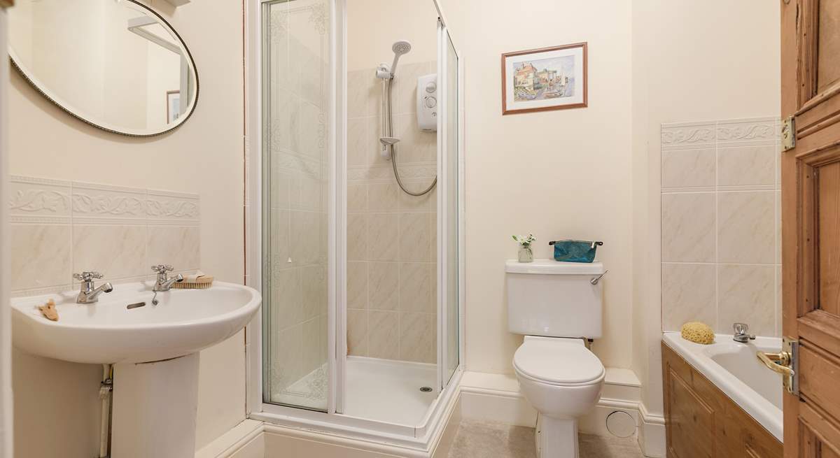 Enjoy a bath or shower at this unique apartment by the sea.