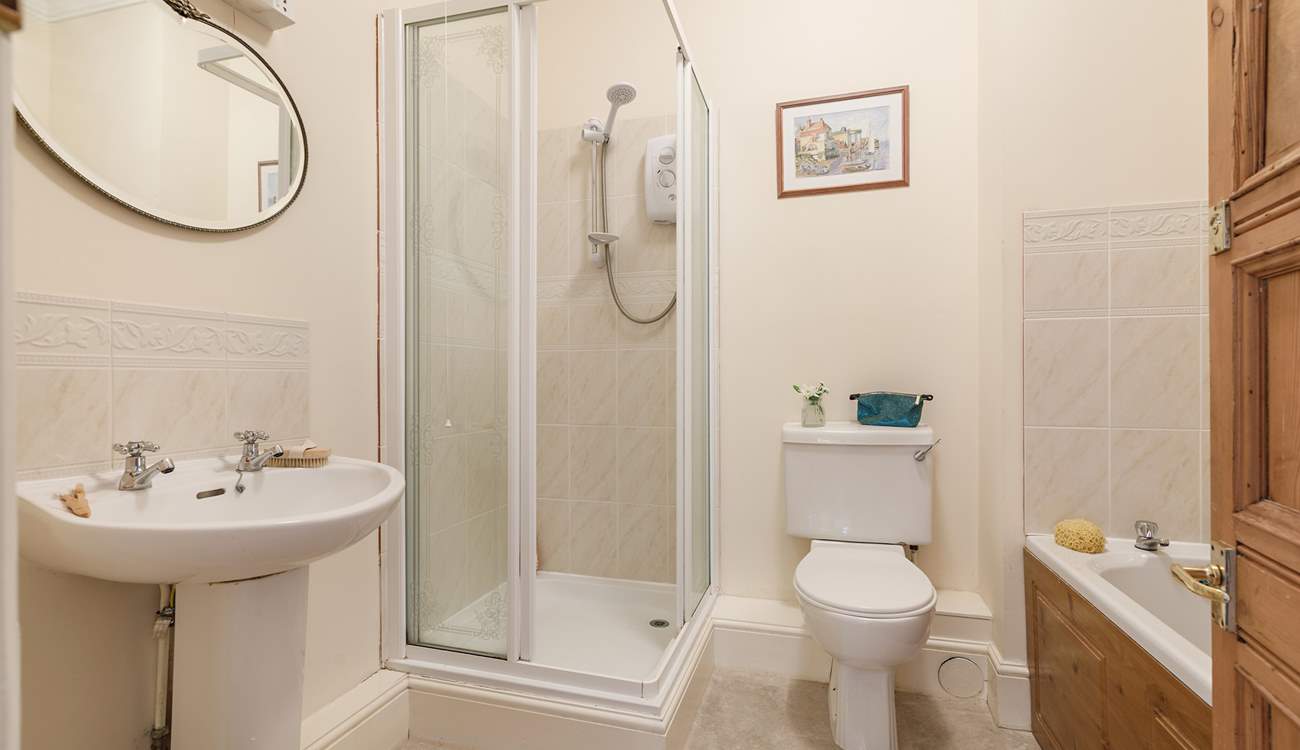 Enjoy a bath or shower at this unique apartment by the sea.