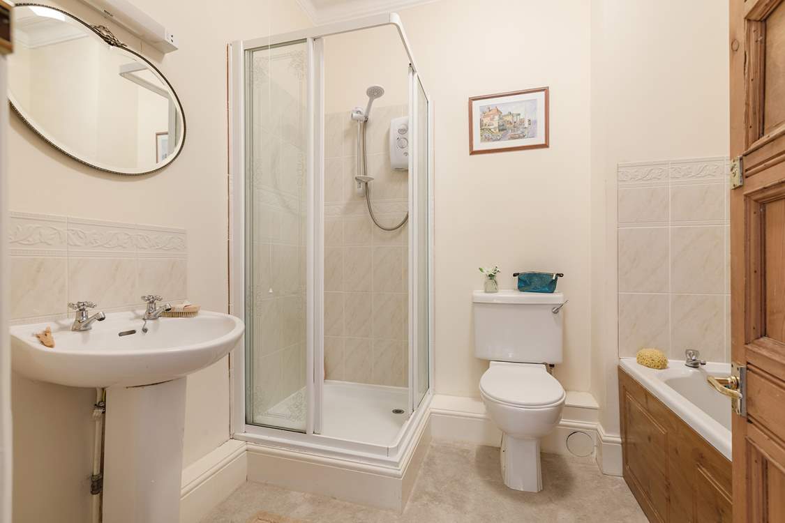 Enjoy a bath or shower at this unique apartment by the sea.