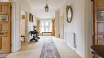 After climbing the stairs you are greeted by this spacious entrance hall.