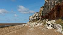 Take a wander along the beach to Old Hunstanton where fossil hunters often browse.