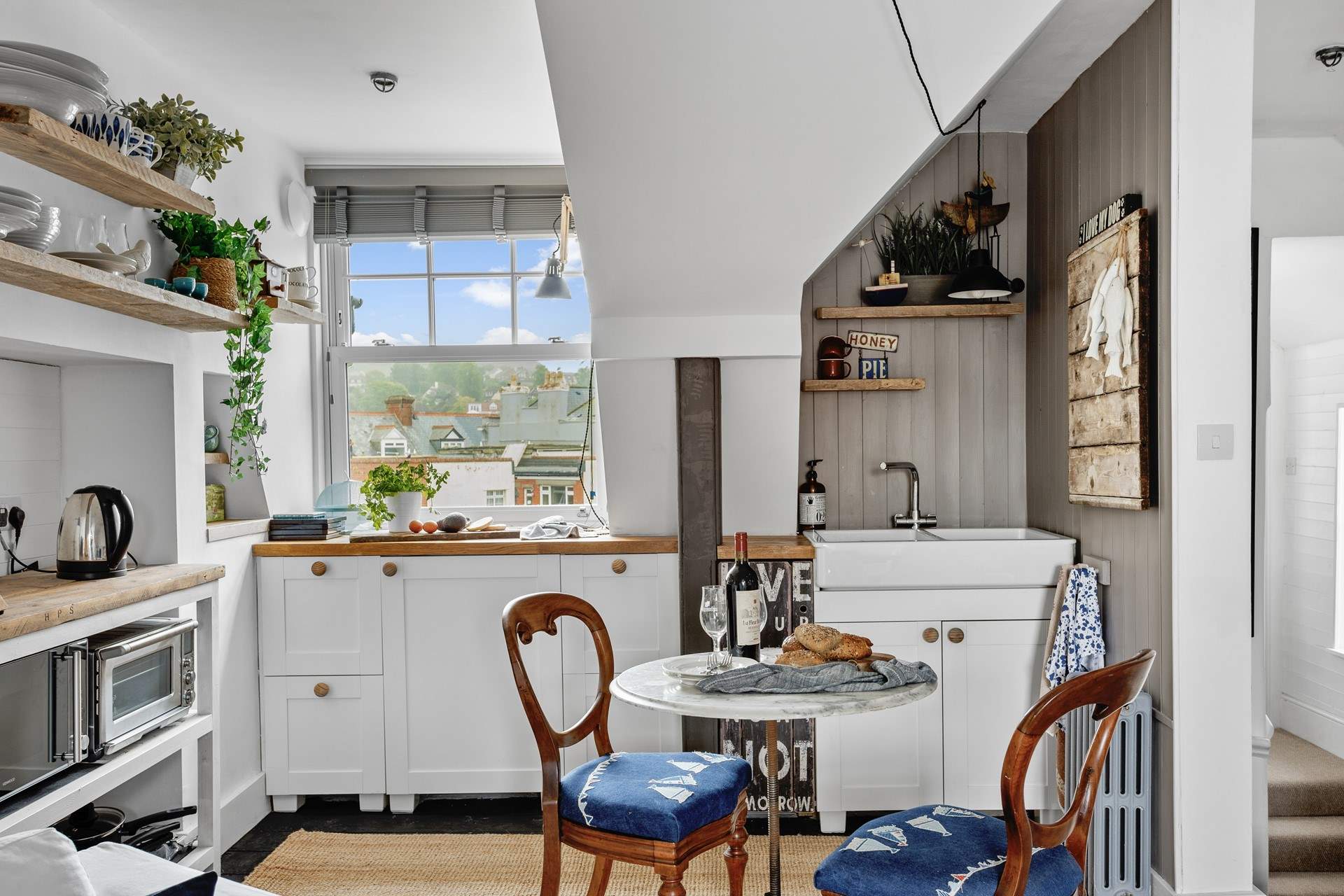 The kitchen is compact, yet holds everything you will need to whip up any meal.