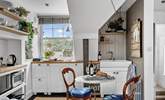The kitchen is compact, yet holds everything you will need to whip up any meal. - Thumbnail Image