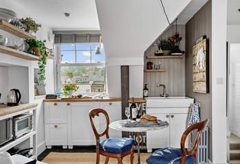 The kitchen is compact, yet holds everything you will need to whip up any meal.