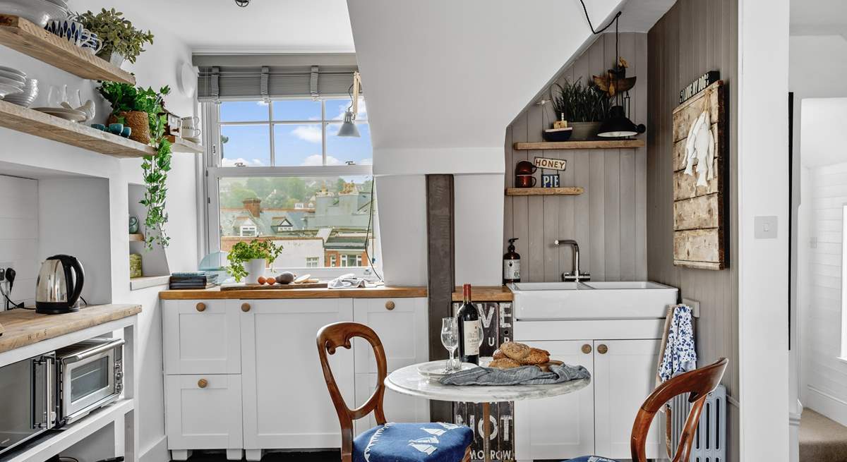 The kitchen is compact, yet holds everything you will need to whip up any meal.