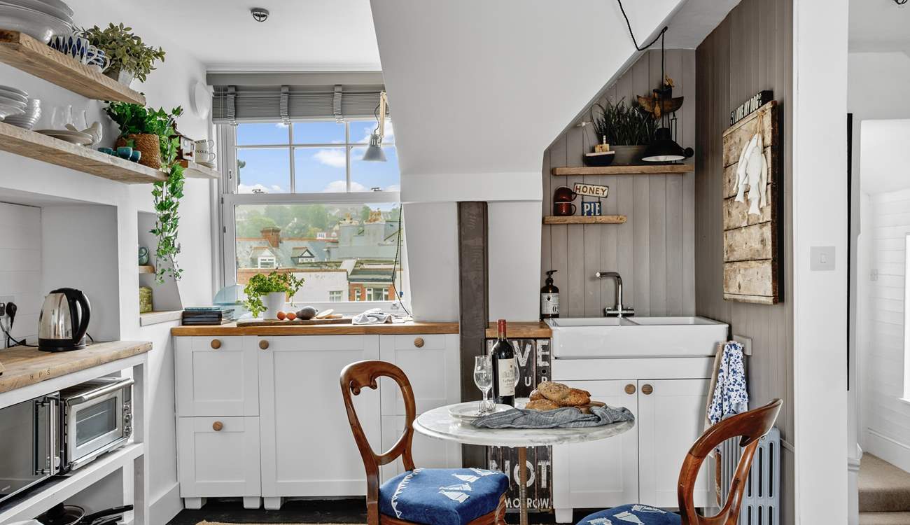 The kitchen is compact, yet holds everything you will need to whip up any meal.