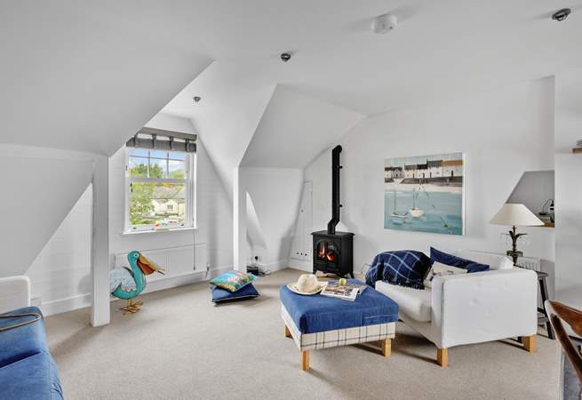 The living-room boasts a wood-burner effect electric stove, perfect for those relaxing nights in.