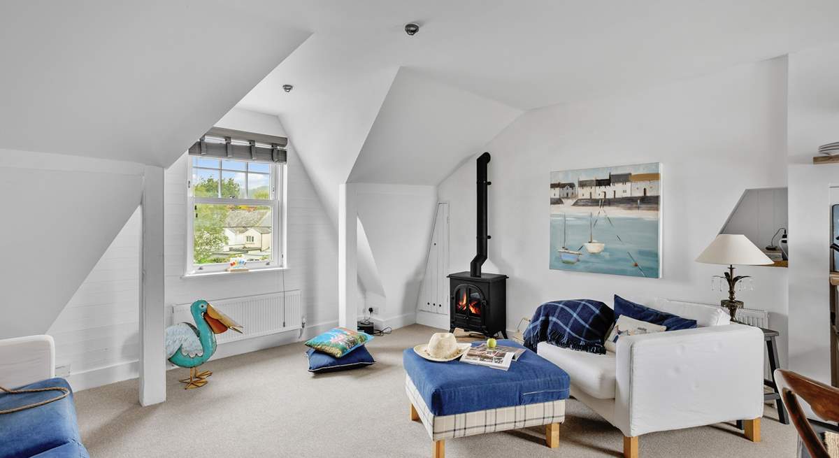 The living-room boasts a wood-burner effect electric stove, perfect for those relaxing nights in.