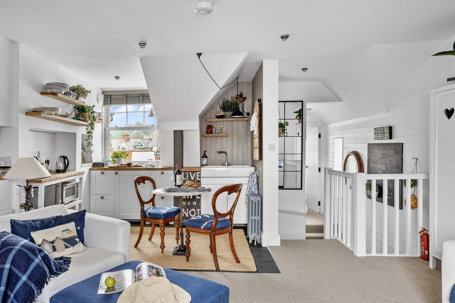 Looking down the hallway towards the bedroom and bathroom. Please take care on the steps which drop down and then lead back up.