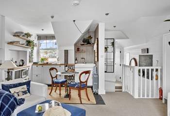Looking down the hallway towards the bedroom and bathroom. Please take care on the steps which drop down and then lead back up.