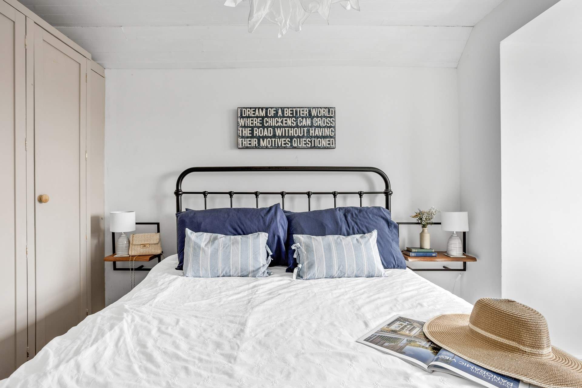 A restful sleep awaits in this king-size bed.