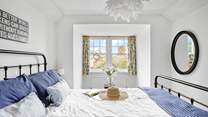 Retiring at night to this inviting king-size bed is always a treat.