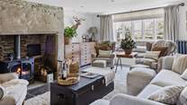 A room that offers the perfect spot to sit back, relax and light the wood-burner. 
